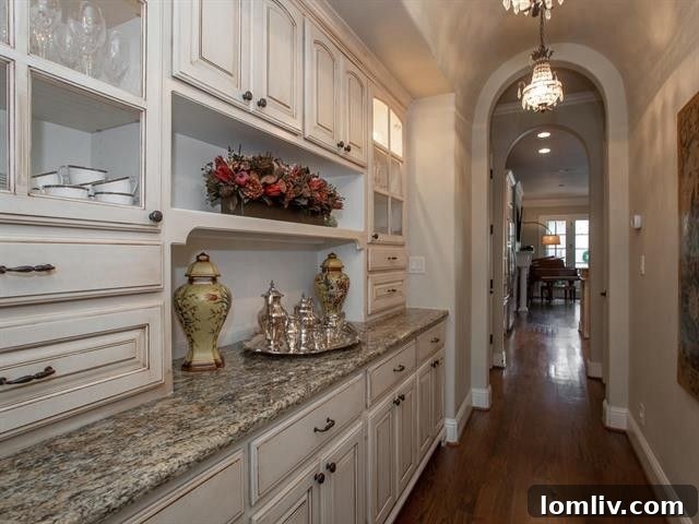 Butler's pantry leading to kitchen in luxury Fort Worth home