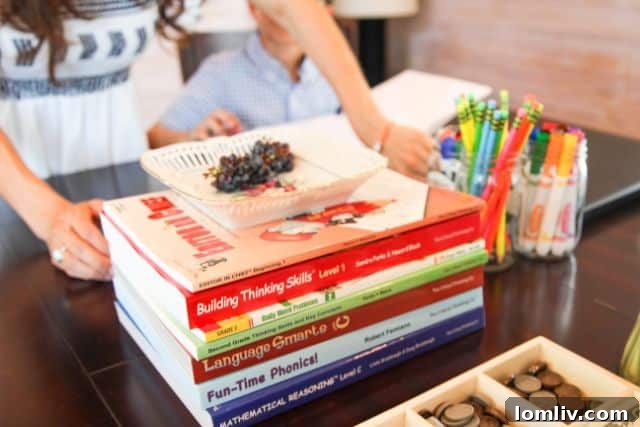 A collection of homeschooling books and educational materials neatly arranged on a rustic farm setting, symbolizing integrated academic and practical learning.