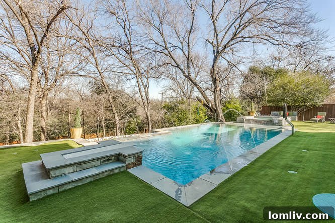 Elegant rectangular pool with integrated lush grass, blending seamlessly into the landscape at 4225 Ranier Court.