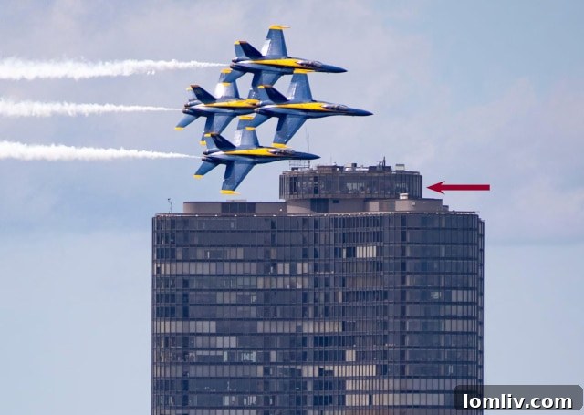 Lake Point Tower standing majestically against the Chicago skyline with Blue Angels flying overhead during an air show
