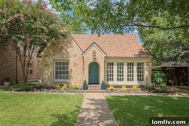 Albany Shaw's Insider Scoop on This Lakewood Hills Tudor Gem 2 Lakewood Hills Tudor exterior with charming brickwork and lush landscaping