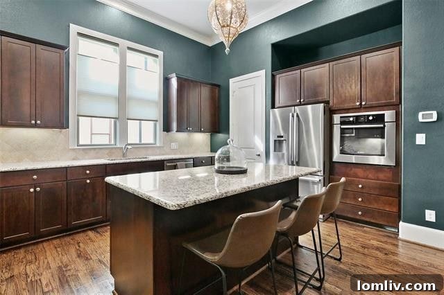 Contemporary kitchen in a Dallas townhome, equipped with high-end appliances and a sleek design.