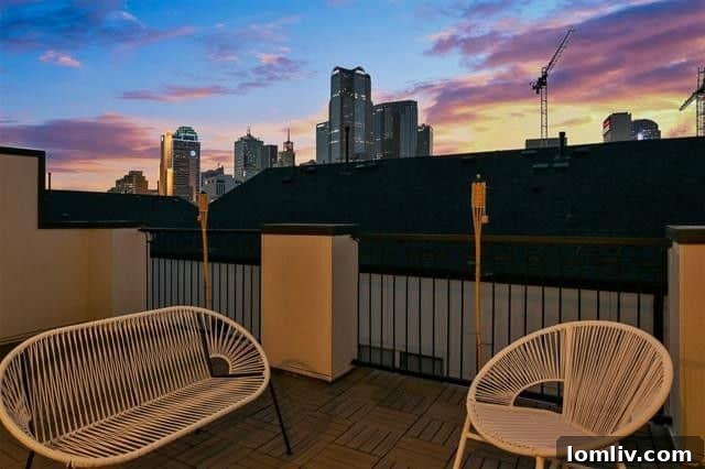 Panoramic city views from a rooftop deck, an ideal space for relaxation and entertaining in a Dallas townhome.