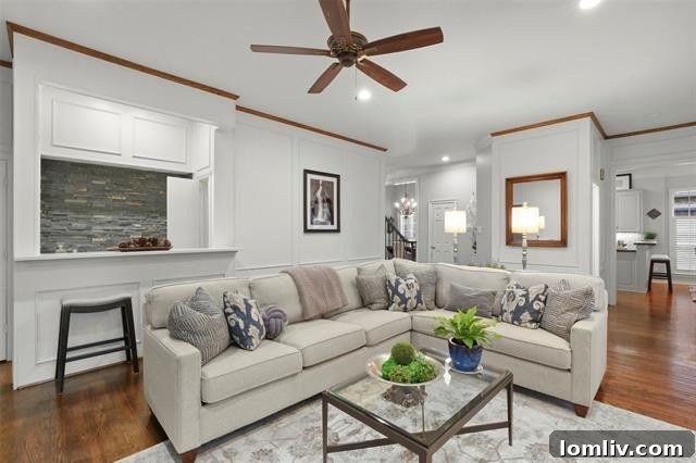 Luxurious master bedroom offering serene views of the private backyard.