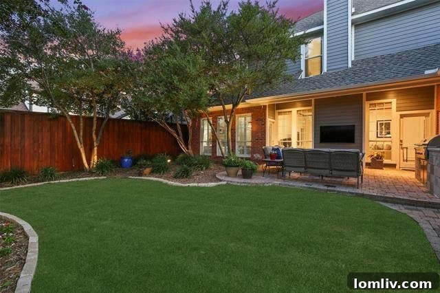 Extremely private backyard oasis with an expansive patio and built-in grill.