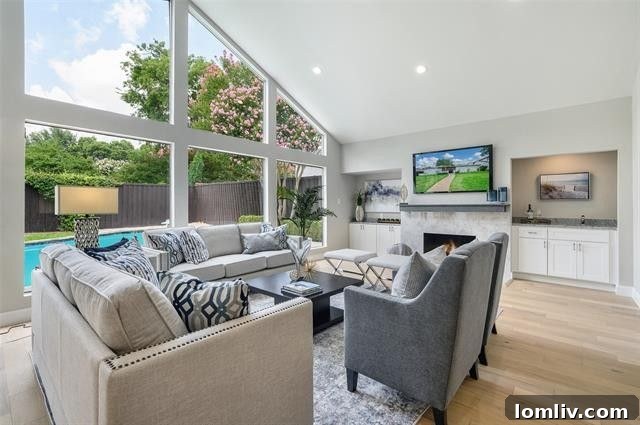 Spacious living area with abundant natural light in a renovated North Dallas home.