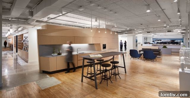 Modern and spacious office kitchen and lounge area, designed for comfort and informal collaboration.