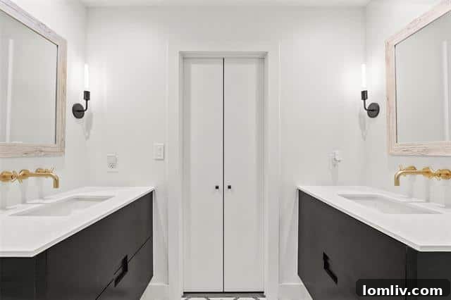 Modern Primary Bathroom with Double Vanities and Geometric Tiles