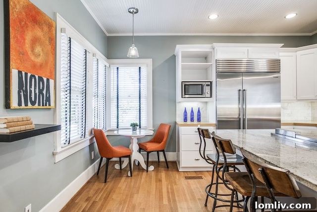Updated kitchen in a Dallas home, featuring new stainless steel appliances and ample counter space.