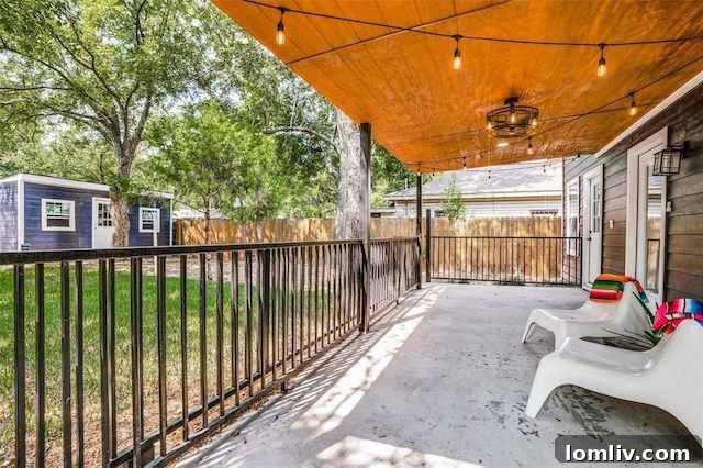 Inviting covered patio in a Dallas home, perfect for outdoor relaxation and entertaining.