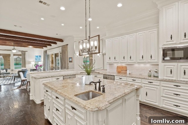 Gourmet kitchen with large island and open concept living area.