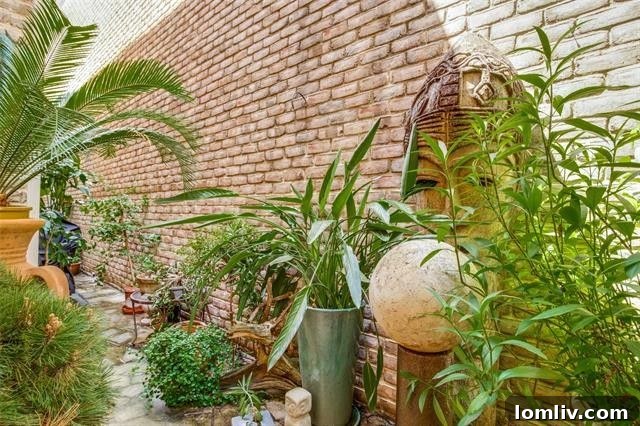 Inviting exterior patio with lush greenery, offering a private outdoor retreat
