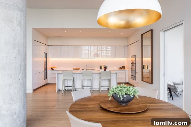 Modern living area in Residence 201, showcasing contemporary art and a refined selection of furniture.