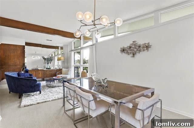 Elegant Living Room with Floor-to-Ceiling Stone Fireplace and Mid-Century Aesthetic