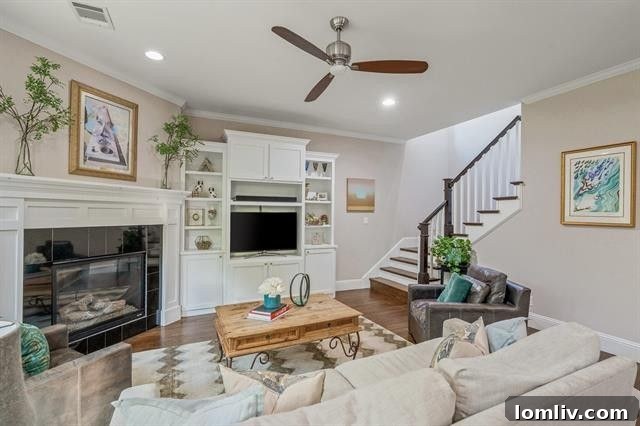 Spacious open-concept living area with a large modern kitchen island and breakfast bar, showcasing elegant cabinetry and abundant natural light at 4223 Merrell Road.