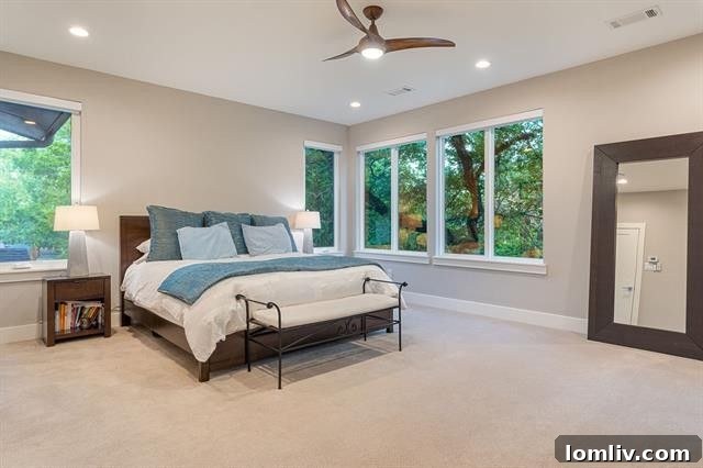 Where Midcentury Modernism Meets Treehouse Wonder 12 A meticulously designed bedroom offering comfort and stylish midcentury decor, with large windows overlooking the natural landscape.