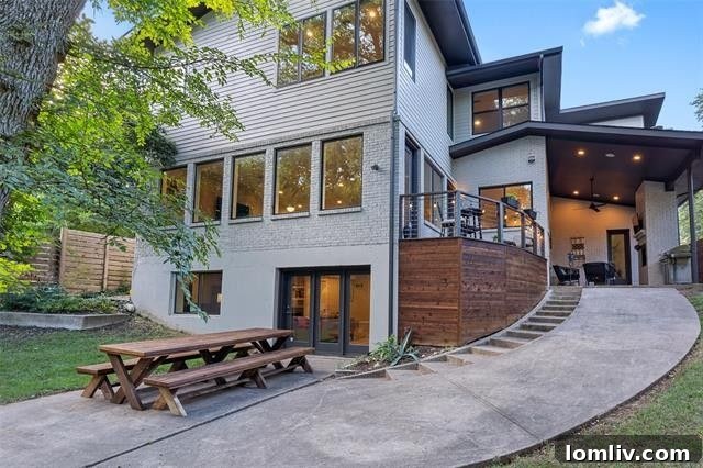 Where Midcentury Modernism Meets Treehouse Wonder 22 An expansive backyard with mature trees and ample green space, ideal for outdoor activities and relaxation.