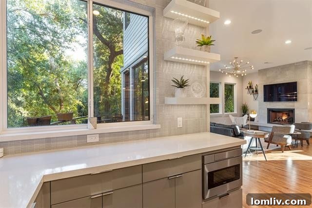 Where Midcentury Modernism Meets Treehouse Wonder 10 A sophisticated living room with comfortable seating and a view of the outdoors, offering a serene environment.
