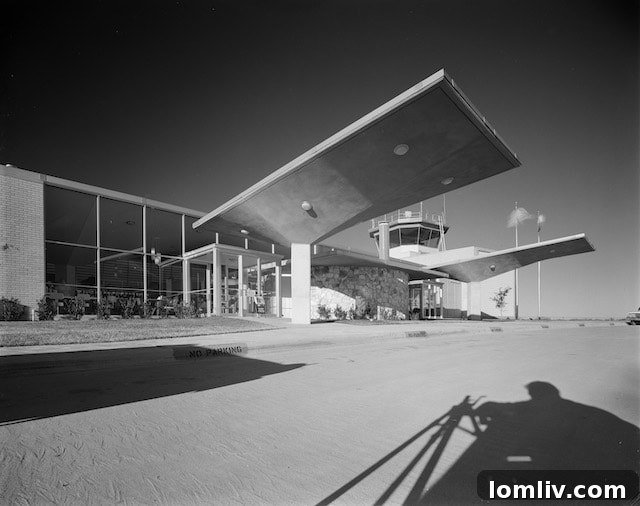 Dallas Airport Terminal in the 1960s, captured in a historical photograph from the John Rogers Collection, showcasing mid-century transportation architecture
