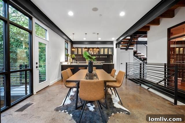 Elegant staircase and open-concept living in a Dallas industrial-chic residence.