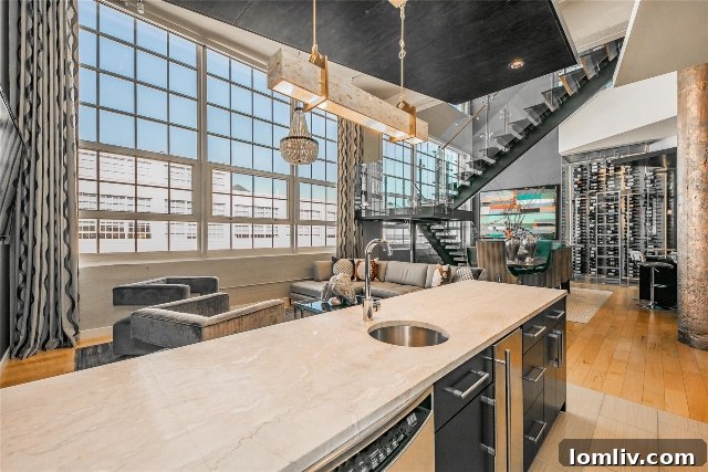 Industrial-chic kitchen with expansive steel-framed windows in a Montgomery Plaza penthouse