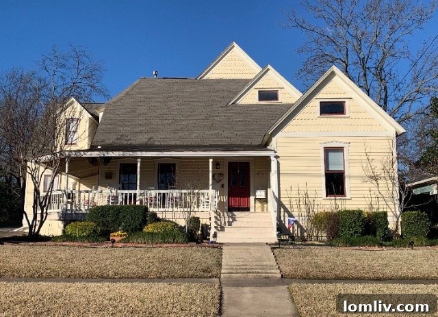 The same gingerbread cottage before its vibrant color transformation, showing its original, less dynamic appearance.