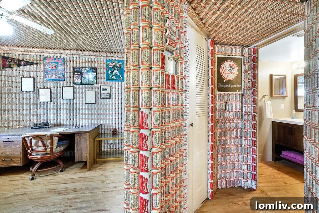 Hallway leading to the bathroom, adorned with Budweiser beer can wall art