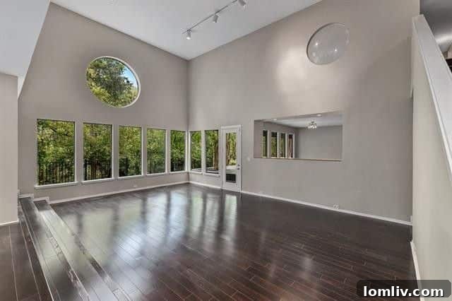 Spacious family room with a striking double-sided fireplace, ready for custom touches