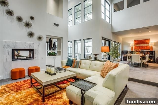 Living room with soaring ceilings and large windows, offering ample natural light in Dallas contemporary home
