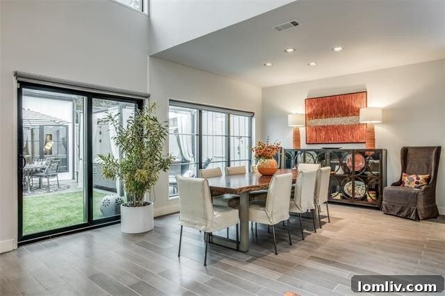 Open-plan dining area overlooking a serene courtyard, perfect for entertaining