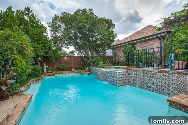 Backyard oasis with a swimming pool and covered patio at 7940 Abramshire Ave.