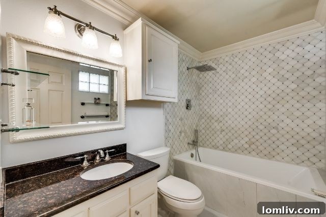 Cozy den with fireplace and glass-front bookcases at 10316 Linkwood Drive