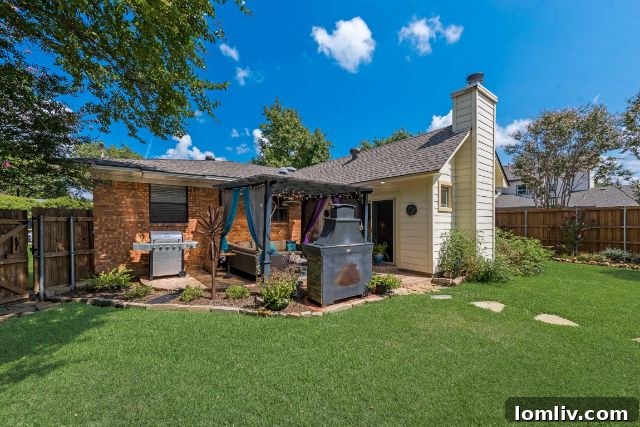 Serene backyard with lush greenery at 10316 Linkwood Drive
