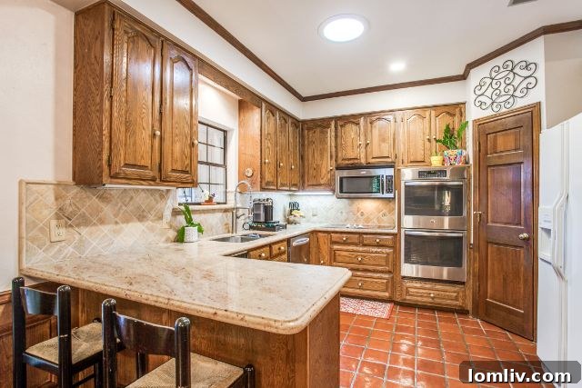 Spacious living room opening to the kitchen at 7940 Abramshire Ave.