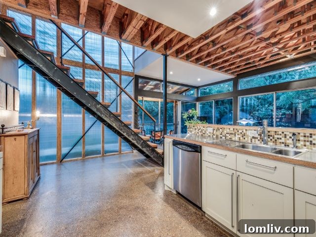 The kitchen area of 8643 Groveland Drive, featuring modern design and ample light.