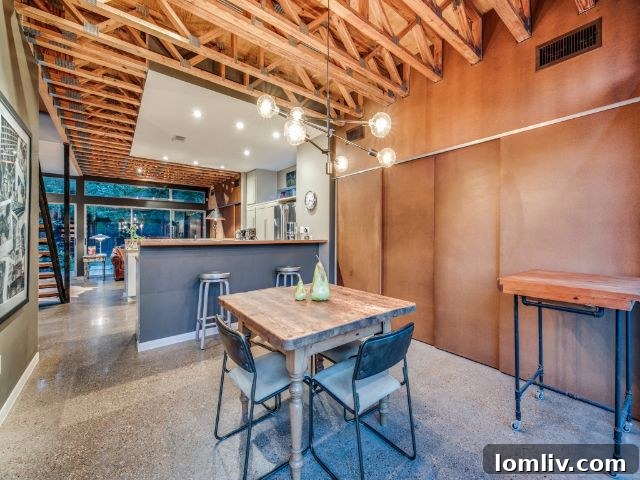 Detailed shot of an interior feature, likely a railing or stairwell component at 8643 Groveland Drive, emphasizing industrial elements.