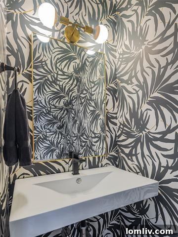 Elegant powder room with designer wallpaper in a renovated Dallas condo