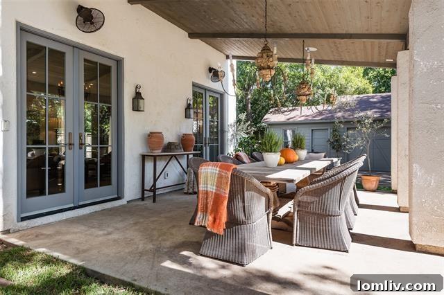 Charming rear view of the home with the dining porch and garden