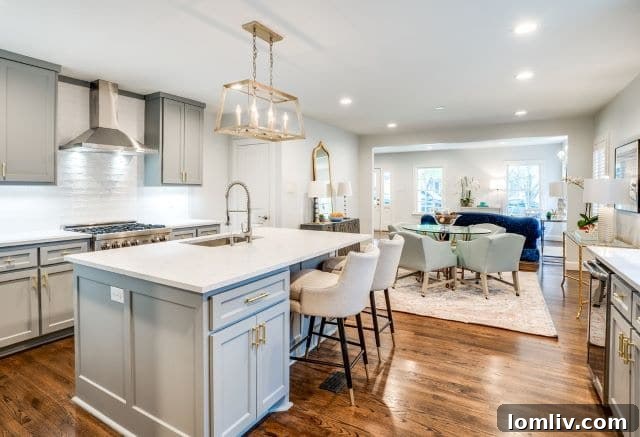 Luxurious gourmet kitchen with custom cabinetry, quartz countertops, and high-end appliances at 3404 Purdue Ave