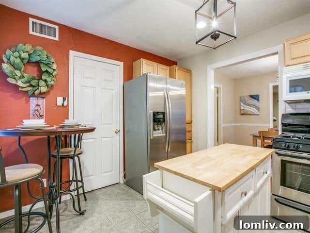 Updated kitchen with modern appliances and built-in storage