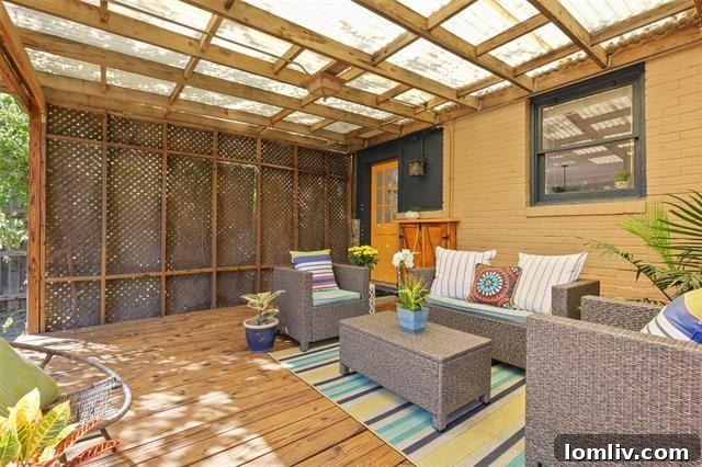 Expansive Covered Back Deck of a Vickery Place Tudor Home
