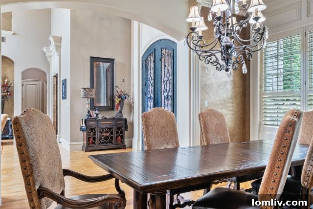 Spacious covered patio with stone fireplace and outdoor kitchen, perfect for entertaining in Southlake