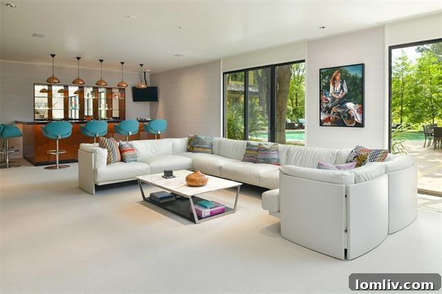 Spacious living room featuring exquisite finishes and a warm, inviting ambiance, characteristic of Scott Lyons' design.