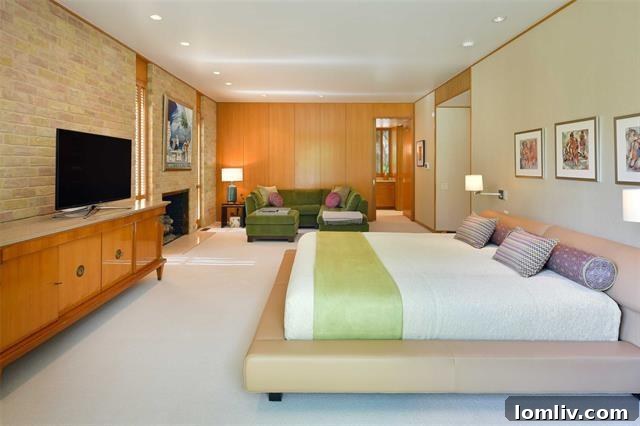 Inviting bedroom with large windows, connecting residents to the lush outdoor environment.