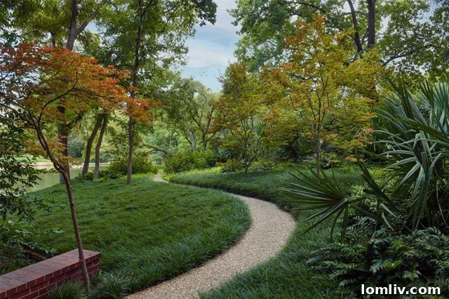 Exterior architecture blending seamlessly with the expansive, private landscape.