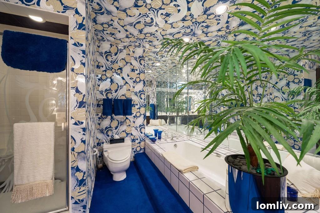 En-suite bathroom covered in a busy, dark-toned wallpaper pattern