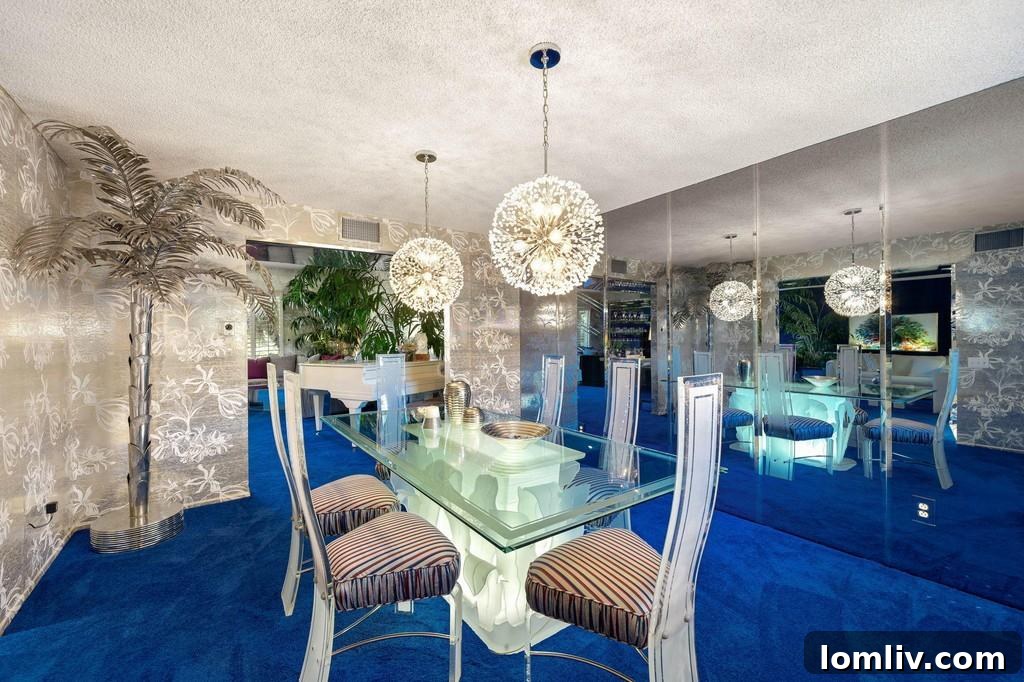 Dining room featuring reflective wallpaper and large mirrors