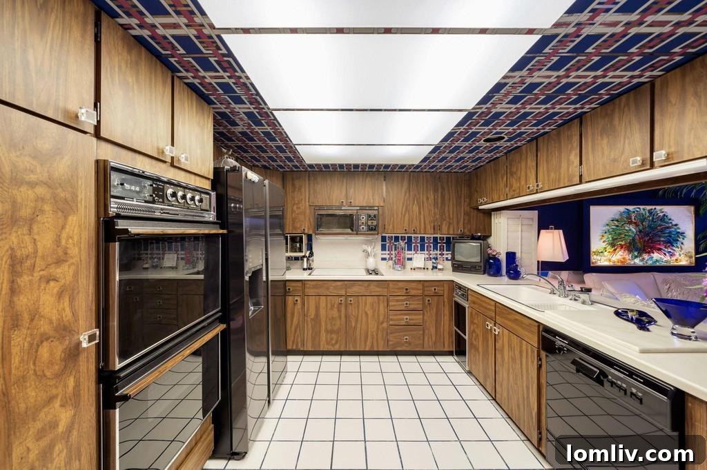 Kitchen with patterned wallpaper on the ceiling and walls
