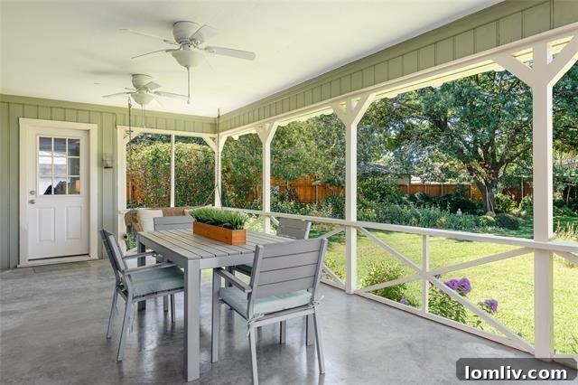 Expansive covered porch overlooking a lush, private backyard at 4174 Willow Grove Road.