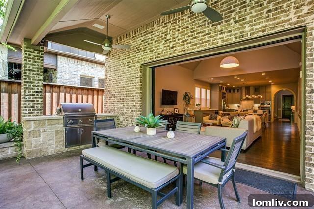 Outdoor patio with a built-in grill and ample space for entertaining at 9411 Monteleon Court.